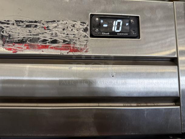 Economy Series EF1A-FS reach-in freezer, stainless steel, one door, temperature display at -10°F, visible scratches and stickers.