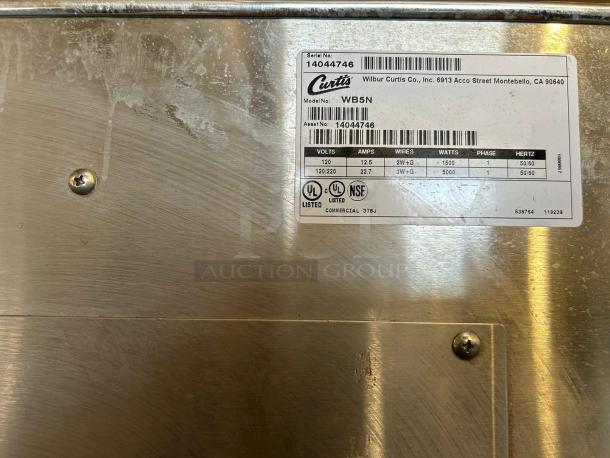 Curtis WB5NL hot water dispenser in excellent condition, 5 gal capacity, 120-220v, fully tested. Features label with specs.