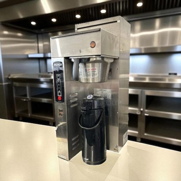 Fetco CBS-2051e E51016b coffee brewer, stainless steel, 1.5-gallon capacity, excellent condition, tested and working. Suitable for commercial use.