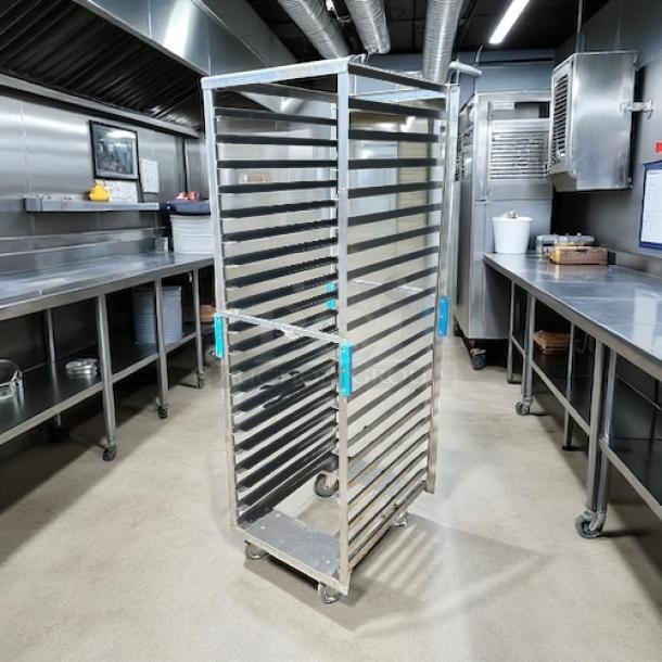 Sheet pan rack, like new, with smooth rolling casters. Durable metal construction, multiple shelves, ideal for bakery use.
