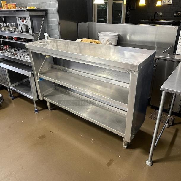 Stainless steel 52" custom table with hand washing station, two shelves; sturdy design; excellent condition.