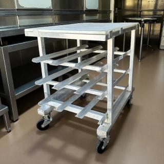 New Age half-size mobile aluminum can rack for #10 and #5 cans in great condition. Features sturdy casters for easy mobility.