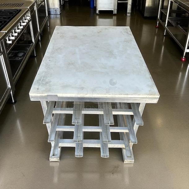New Age half-size mobile aluminum can rack for #10 and #5 cans in great condition. Industrial setting. No visible tags.
