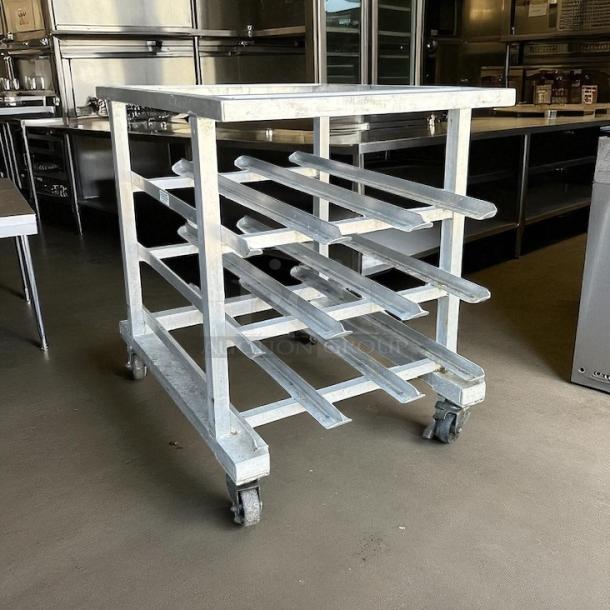 New Age Model 25 aluminum can rack, excellent condition, for #10 and #5 cans, mobile, no cutting board, with casters.