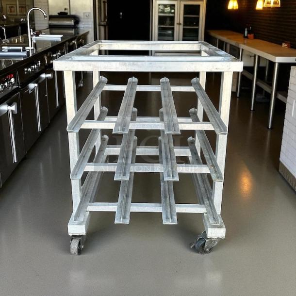New Age Model 25 half-size mobile aluminum can rack for #10 and #5 cans, excellent condition, no cutting board.