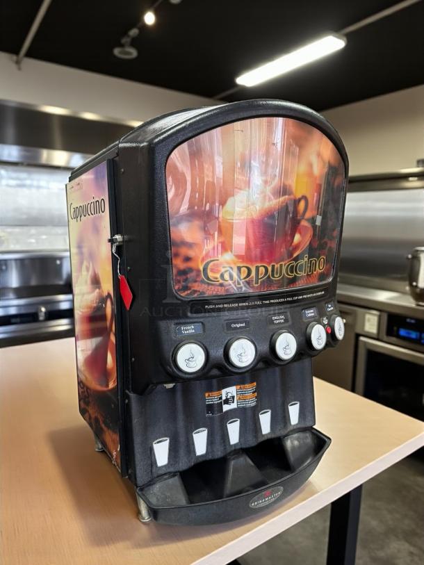 Grindmaster PIC5 hot chocolate/cappuccino dispenser, 5 flavors, good condition. Features 5 five lb hoppers, 120v, tested, working.
