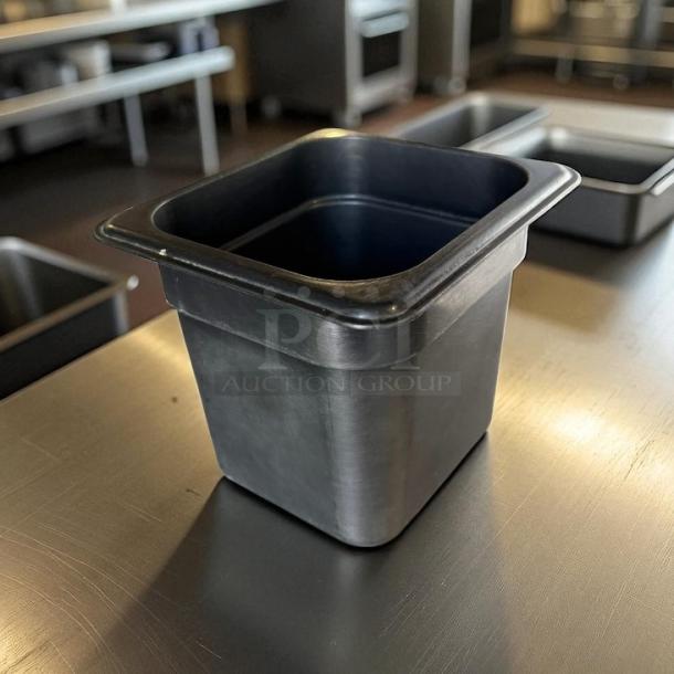 Cambro black 1/6 size deep food storage container, 6 inches deep, clean and compact, ideal for efficient kitchen storage.