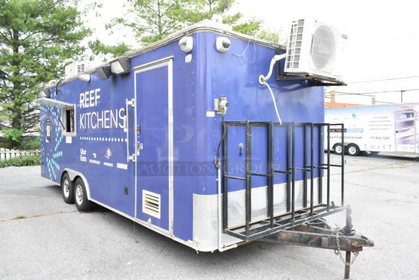 Blue mobile kitchen trailer, previously Popeyes, equipped with grease hood, Henny Penny fryer, coolers, freezers, prep tables.