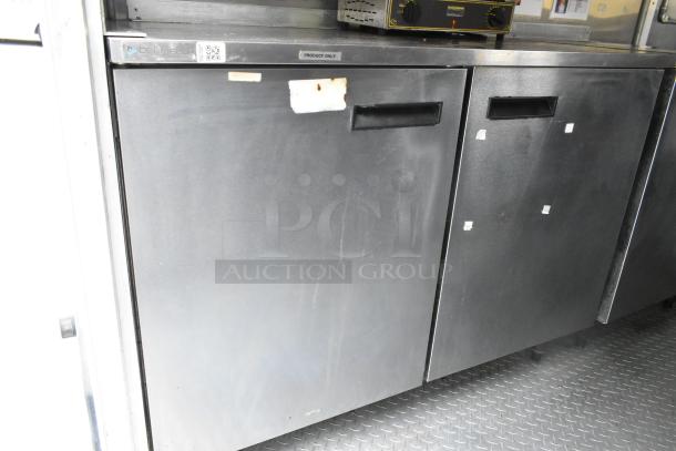 Popeyes food trailer cooler doors with clean stainless steel finish, "Produce Only" label, suitable for a mobile kitchen.