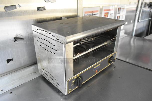 Stainless steel countertop toaster oven inside a fully outfitted former Popeyes food trailer. Features temperature control and used condition.