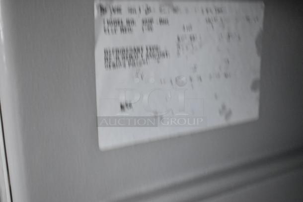 Blurry label on a former Popeyes food trailer with clear title. Details not legible.