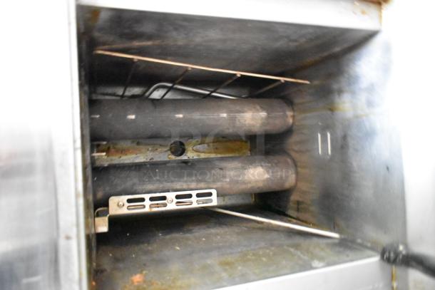 Interior view of a food trailer appliance, showing used components with mild discoloration, suitable for mobile kitchen setup.