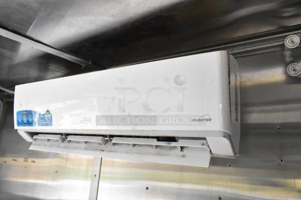 Air conditioning unit inside fully outfitted food trailer, showing inverter technology and control panel. Used condition.
