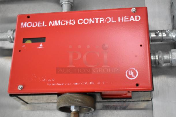 Red Model NMCH3 control head in mobile kitchen, featuring a UL mark and secure pipeline connections.