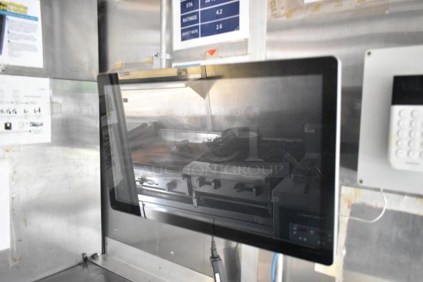 Fully equipped fried chicken food trailer interior showing cooking range and Henny Penny fryer. Suitable for ghost kitchen.
