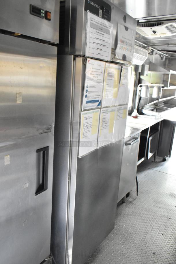 Fully outfitted former Popeyes food trailer with grease hood, Henny Penny fryer, coolers, freezers, and prep tables.