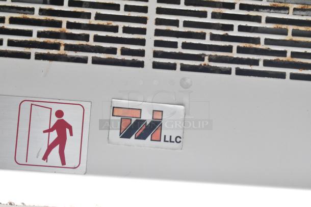 Mobile food trailer with grease hood vent and TWI LLC label. Features Popeyes kitchen equipment. Clear title.