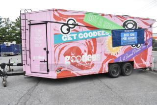 Pink 2020 Goodees food trailer with colorful graphics. Includes cooler, freezer, blender, shelves, sinks. Clear title.
