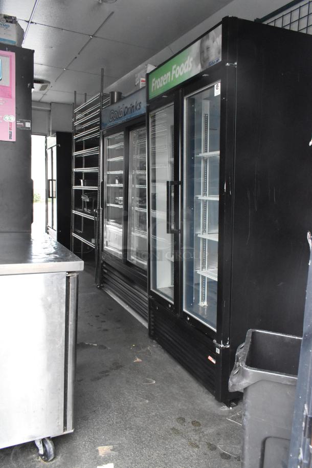 2020 Goodees food trailer interior with 2-door cooler, freezer merchandisers, shelving units, and sinks. Clear title.