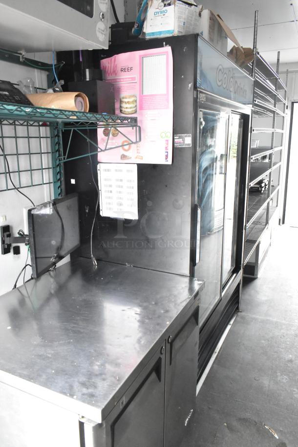 2020 Goodees food trailer interior with two-door cooler, freezer, shelving, sink, stainless steel countertop. Clear title.