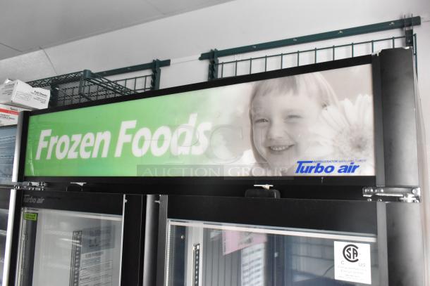 2020 Goodees food trailer detail showing Turbo Air branded 2-door cooler, signage reading "Frozen Foods".