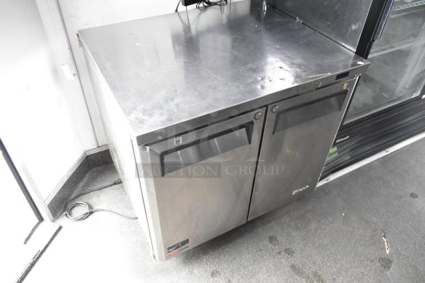 Stainless steel two-door cooler in a 2020 Goodees food trailer, featuring a sleek design and durable construction.