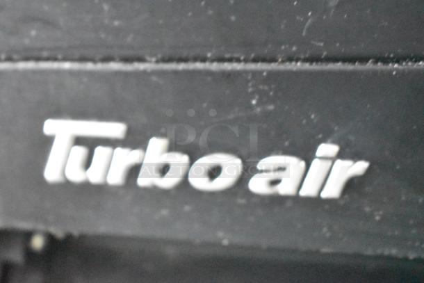 "Turbo air" logo on a black surface, part of the 2020 Goodees Food Trailer cooling system.