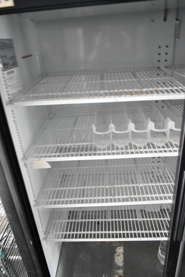 Interior view of a 2-door cooler with multiple wire shelves, housed in a 2020 Goodees food trailer. Clean, ready to use.