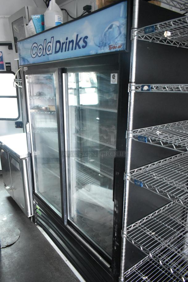 2020 Goodees food trailer interior with 2-door cooler, Turbo Air Cold Drinks display, metal shelving. VIN 4S9S1EF26LW364359.