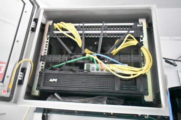 Server rack with APC UPS and network cables in the 2020 Goodees Food Trailer.