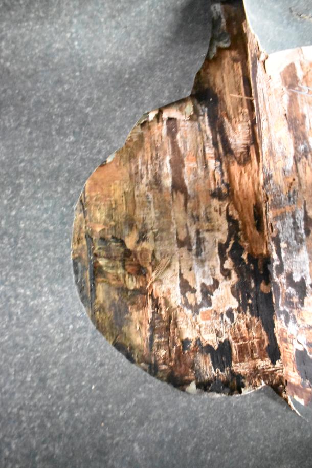 Image shows a weathered and partially obscured wooden texture with dark and earthy tones. No visible items or features related to the auction listing are present.
