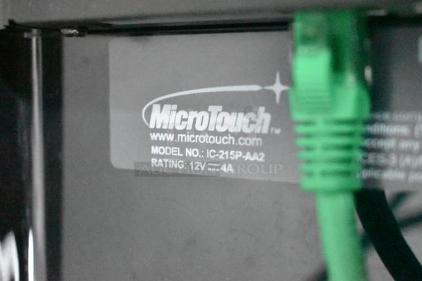 Alt text: MicroTouch label showing Model No. IC-215P-AA2, rating 12V -- 4A, with green cable connected.