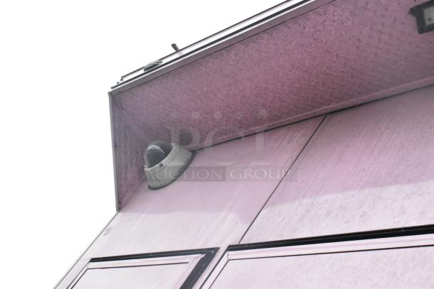 Exterior view of a 2020 Goodees food trailer with a security camera installed under an awning.