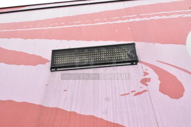 2020 Goodees Food Trailer exterior with vibrant red and pink design, featuring a rectangular black light fixture.