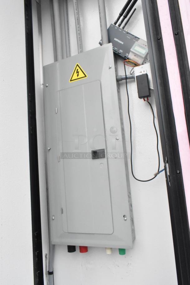 Image of a 2020 Goodees Food Trailer's electrical panel and wiring setup, featuring a Samsara device. Safety symbol visible.