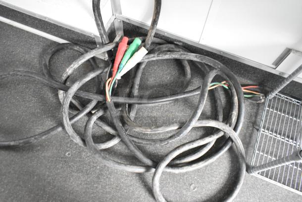 Coiled electrical cables inside 2020 Southern Dimensions Group Trailer, GVWR 6,350 KG/14,000 LB, visible wiring, black and gray interior.