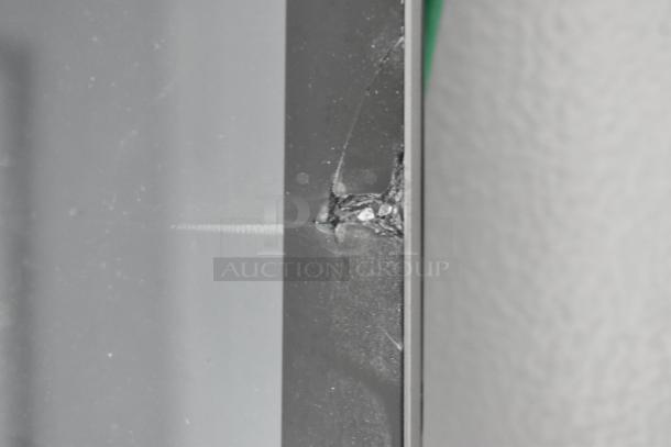 Close-up of a damaged surface on the 2020 Southern Dimensions Group Trailer, showing a crack or impact mark.