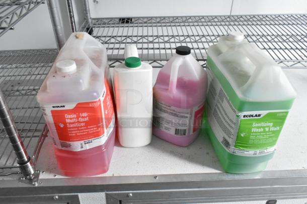 Four large jugs of cleaning solution on a metal shelf, including Ecolab Oasis 146 Multi-Quat Sanitizer and Sanitizing Wash 'N Walk.