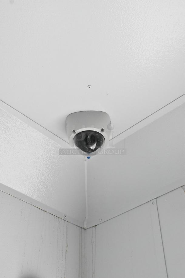 Ceiling-mounted security camera inside 2020 Southern Dimensions Group Trailer. Clean white interior with visible wiring.