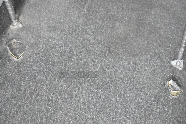 Interior floor of 2020 Southern Dimensions Group Trailer; gray carpet, minor wear visible, support legs in metal. GVWR 14,000 LB.