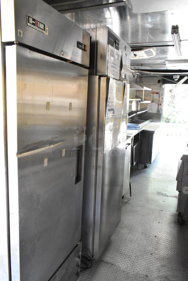 Brand new 2019 food trailer with stainless steel interiors, U-Star coolers, prep tables, and appliances for a mobile kitchen.