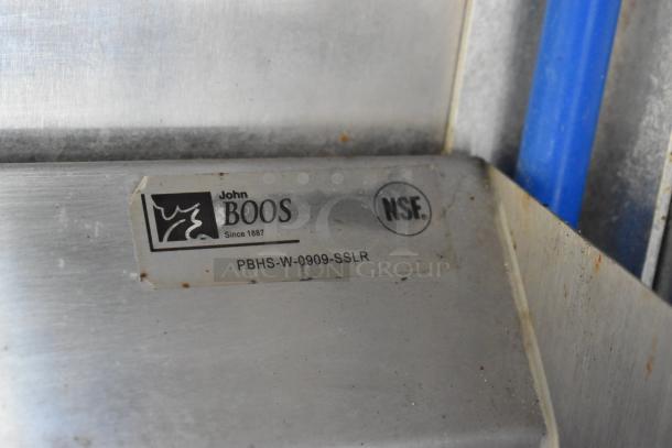 Close-up of a John Boos stainless steel kitchen fixture with NSF certification and model PBHS-W-0909-SSLR.