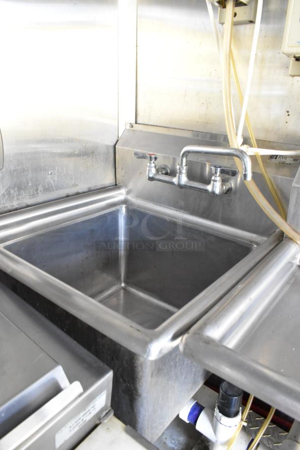 Stainless steel sink and faucet inside a fully outfitted 2019 food trailer. Ideal for diverse culinary uses.