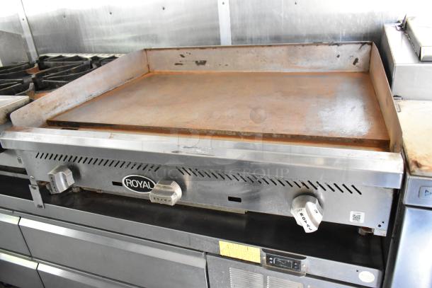 Royal griddle in a new 2019 mobile kitchen trailer. Features gas knobs and stainless steel finish. Ideal for versatile cooking concepts.