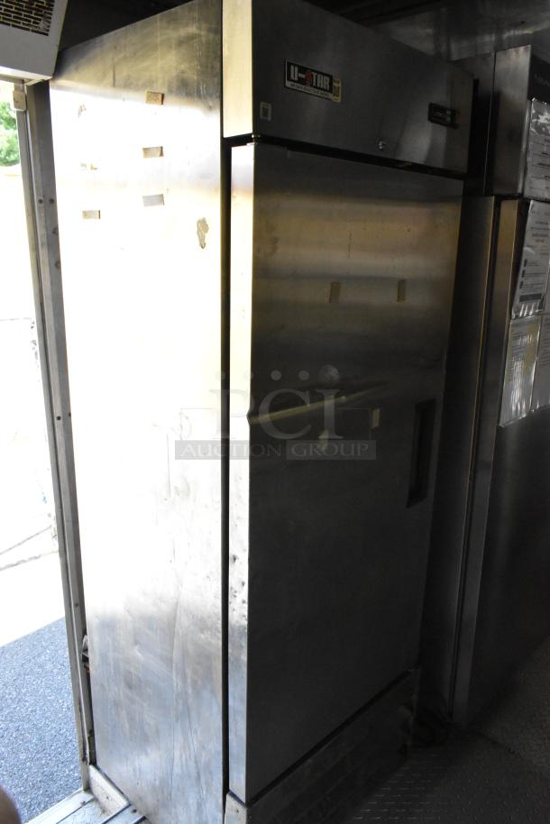 Fully outfitted food trailer's interior with U-Star refrigerator, showcasing stainless steel finish, ready for mobile kitchen use.
