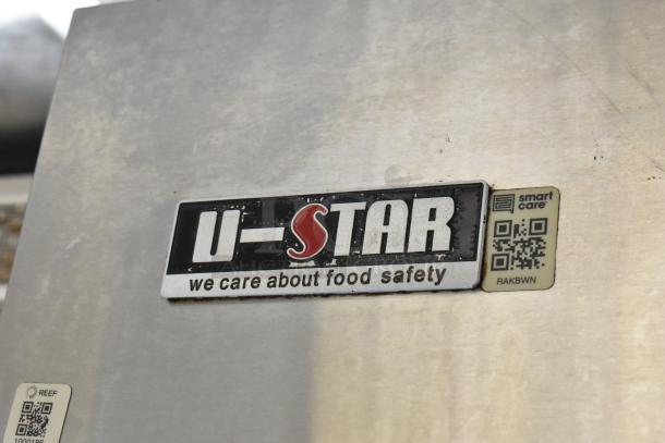 U-Star equipment label on industrial kitchen appliance with text "we care about food safety" and QR code for smart care.