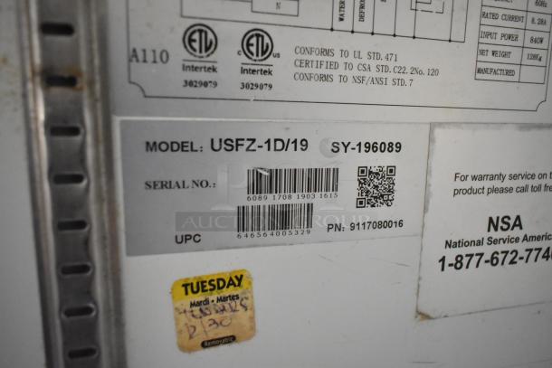Label on food trailer appliance showing model: USFZ-1D/19, serial: SY-196089, with UPC, barcode, and NSA contact info.