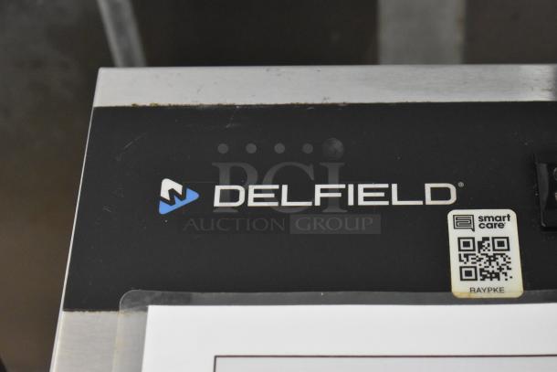 Delfield appliance tag, featuring logo and Smart Care QR code, part of new 2019 fully outfitted food trailer.