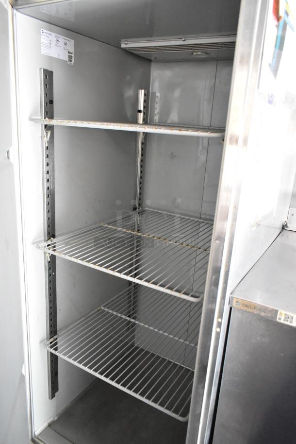 Inside view of a new DelField cooler in a fully outfitted 2019 food trailer. Includes adjustable wire shelves.