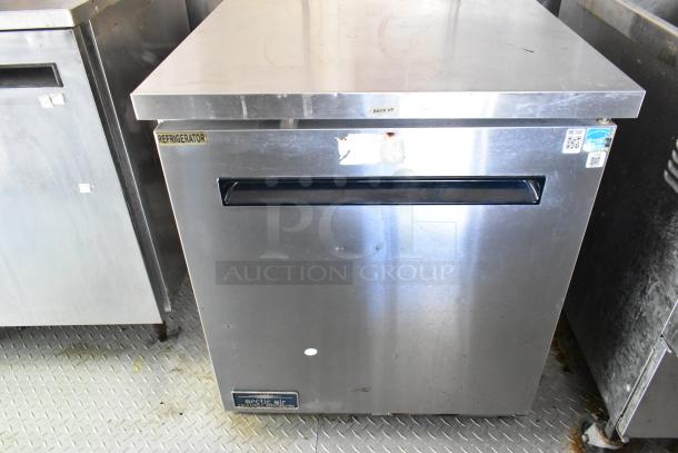Stainless steel Arctic Air refrigerator, model unclear, with "Refrigerator" label, showing a front handle, excellent condition.